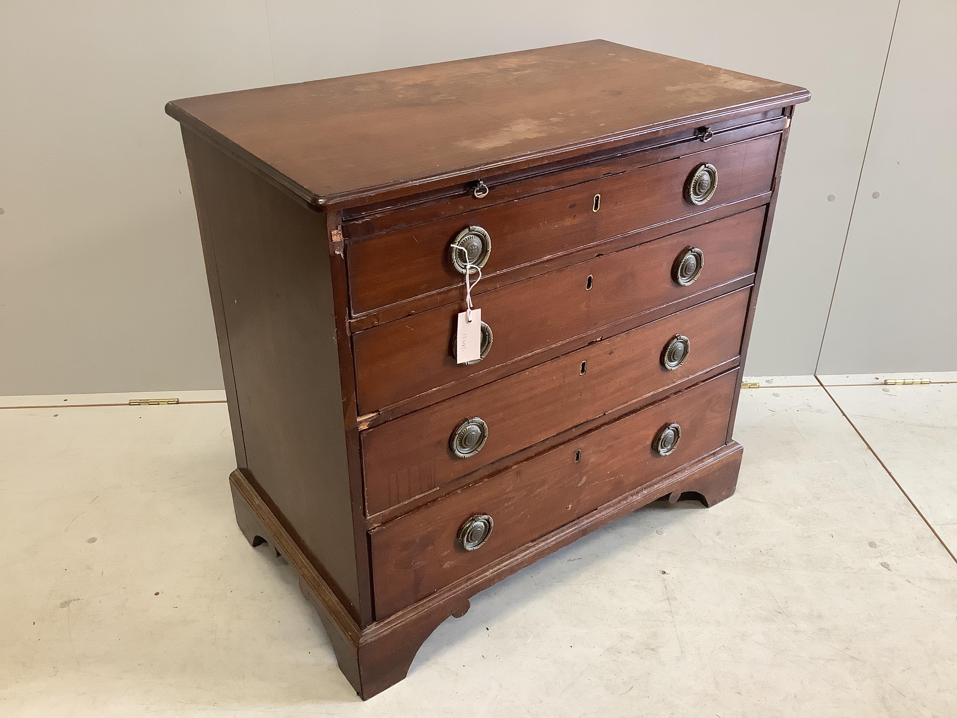 A small early 19th century four drawer mahogany chest with brushing slide, width 83cm, depth 47cm, height 78cm